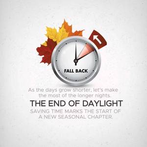 Clock with falling leaves indicating the end of daylight saving time.