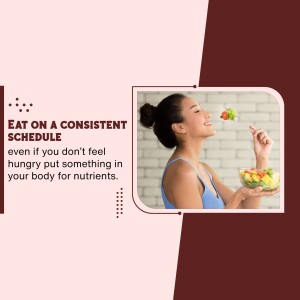 Woman enjoying a healthy salad, promoting consistent eating habits.