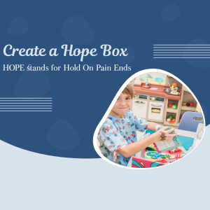 A young boy creating a 'Hope Box' with art supplies, with a kitchen playset in the background.