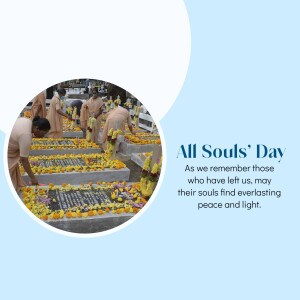 People tending to graves decorated with flowers on All Souls' Day