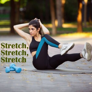 Woman doing a stretch exercise on a yoga mat in a park.