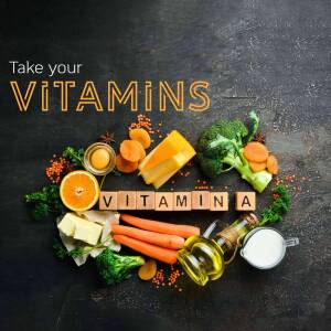 A flat lay of various vitamin-rich foods including fruits, vegetables, dairy, and supplements.
