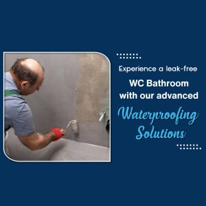 A worker applying waterproofing solution to a bathroom wall.