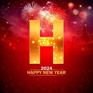 Golden 'H' with fireworks and a New Year's celebration background