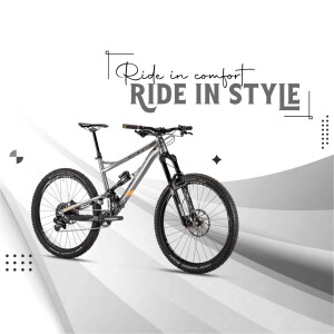 Silver and black mountain bike with the text 'Ride in Comfort, Ride in Style'