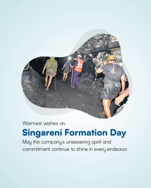 Workers walking through a coal mine with Singareni Formation Day message