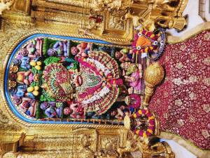 Close-up of a beautifully decorated Hanuman idol in a temple