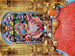 Close-up of a beautifully decorated Hanuman deity in a temple