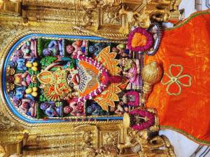 Close-up of a beautifully decorated Hanuman idol in a temple