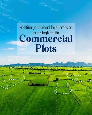 Aerial view of commercial plots with location markers and mountain backdrop