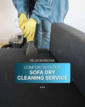 Person cleaning a gray sofa with a vacuum cleaner and wearing yellow gloves.