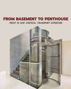 A modern glass home elevator installed in a residential building.