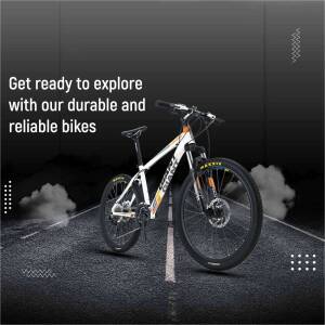 A white and yellow mountain bike on a road with smoke effects.