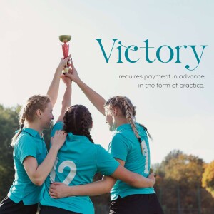Three female athletes celebrating a win with a trophy raised in the air.