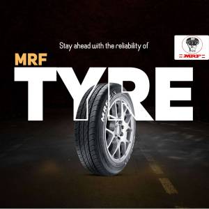 Close-up of an MRF tyre with the text 'TYRE' prominently displayed.