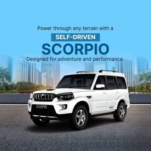 White Mahindra Scorpio SUV parked in front of a city skyline