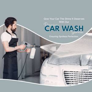 Man washing a car with a pressure washer