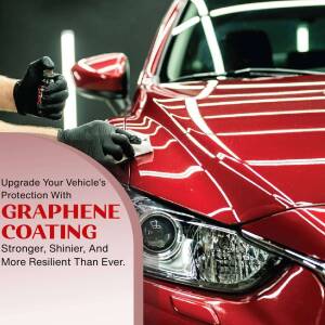 Close-up of a hand applying graphene coating to a red car