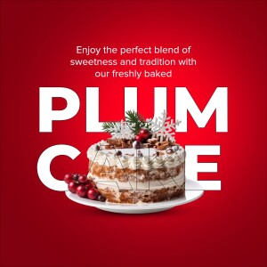 A beautifully decorated plum cake with winter berries and a snowflake garnish on a red background.