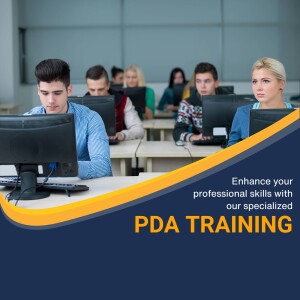 Students in a classroom using computers for PDA training