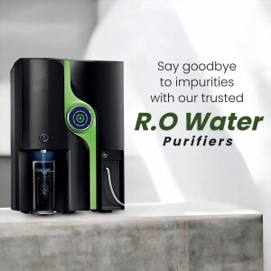 Black and green RO water purifier with a glass of water