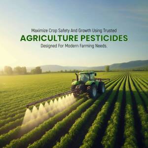 Tractor spraying pesticides on a green field