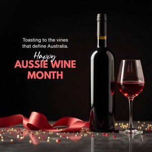 Bottle and glass of red wine with ribbon and confetti, celebrating Aussie Wine Month