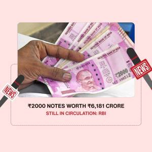Image of a hand holding Indian 2000 rupee notes with a news graphic.