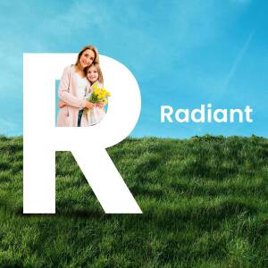 A large white letter 'R' with a mother and daughter standing inside it, set against a green field and blue sky.