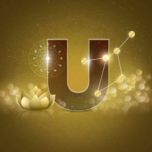 Golden letter U with astrological symbols and a lotus flower