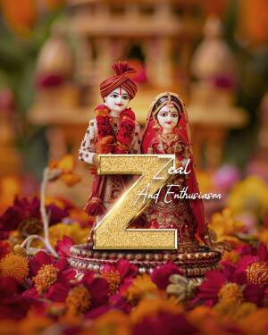 Close-up of intricately decorated Indian bride and groom statuettes adorned with flowers.