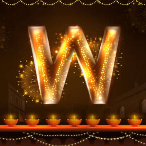 Letter W illuminated with Diwali lights and fireworks