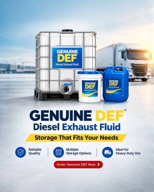 A large industrial container and smaller jugs of Genuine DEF diesel exhaust fluid with a semi-truck in the background.