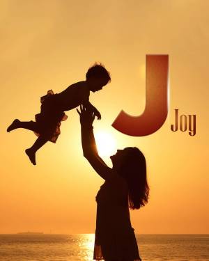 Silhouette of a mother lifting her child against a sunset with a large letter J
