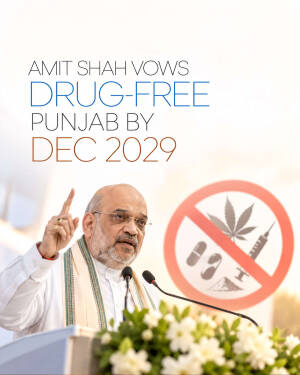 Amit Shah speaking at a podium with a no-drugs sign in the background