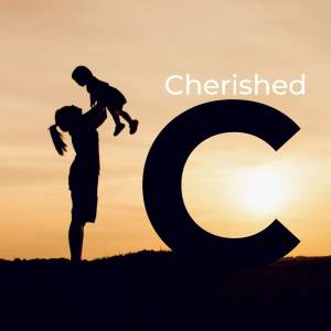 Silhouette of a mother lifting her child against a sunset with a large letter 'C'