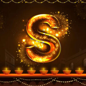 Golden letter S with fireworks and Diwali lights