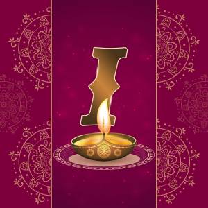Golden letter 'I' shaped like a lit diya lamp with decorative mandala background