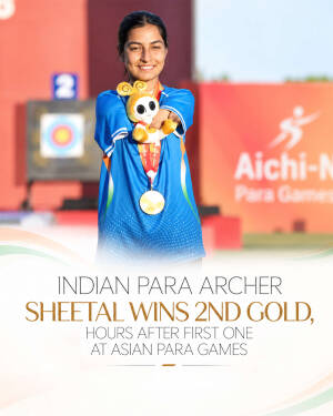 Indian para archer Sheetal Devi smiling and holding a gold medal and mascot at the Asian Para Games