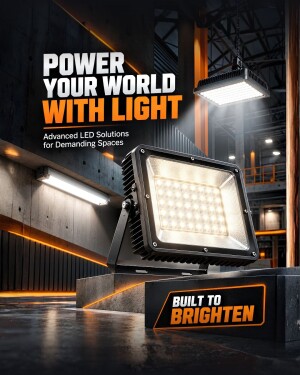 A powerful LED floodlight illuminate an industrial workspace with orange accent branding