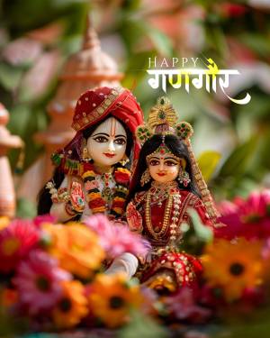 Close-up of Krishna and Radha dolls decorated with flowers for Janmashtami