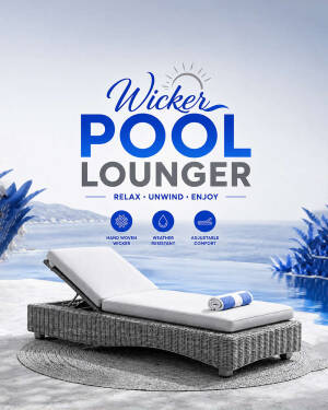 A modern grey wicker pool lounger with white cushions by the ocean.