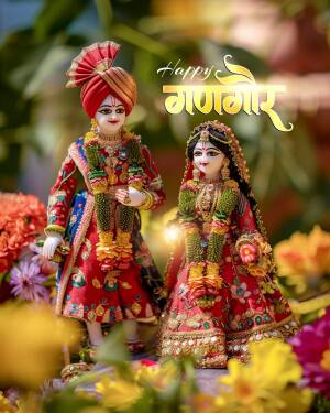 Two beautifully dressed dolls representing a couple, celebrating Gangaur festival.