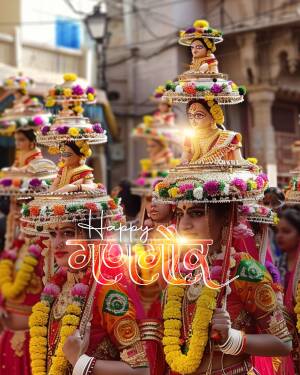 Women carrying decorated pots on their heads during Navratri festival