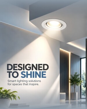 A ceiling-mounted recessed spotlight illuminating a modern white wall in a contemporary living space