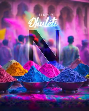 Colorful powders and a 'Happy Dhulandi' text with the letter 'N' in the foreground during Holi festival.