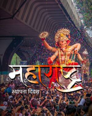 Large Ganesha idol during Ganesh Chaturthi festival with a crowd of devotees