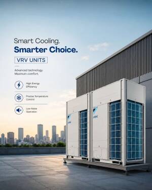 Daikin VRV air conditioning units on a rooftop against a city skyline at sunset