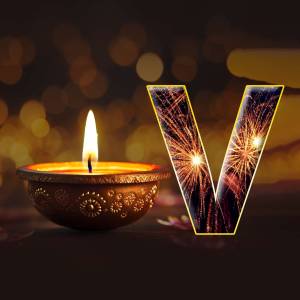 A diya lamp and the letter V with firework effects, representing Diwali