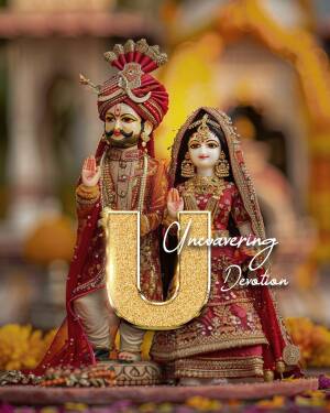 Close-up of traditional Rajasthani dolls depicting a groom and bride, adorned with intricate details and vibrant colors.